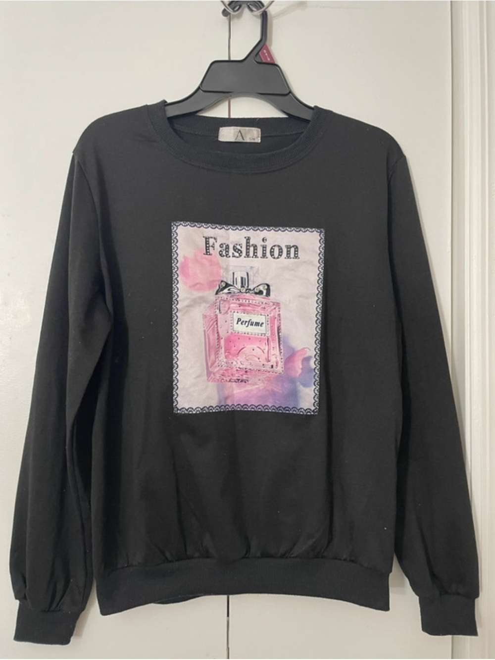Fashion Graphic Black Sweatshirt with Pink Perfume Print